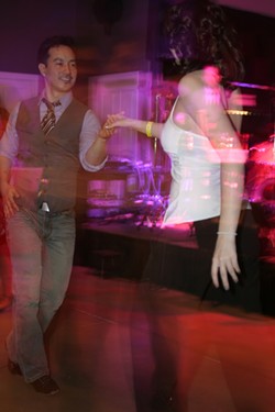 DANCING DJ :  Cal Poly Salsa Club member and DJ Chance Siri shows off his dance skills. - PHOTO BY GLEN STARKEY