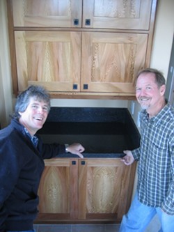 NATURES ART :  Locally grown sycamore, a relative of maple, was used by cabinetmaker Clark Kluver (right) for the cabinets in the Arroyo Grande home of Mike Geringer (left). - PHOTO BY KATHY JOHNSTON