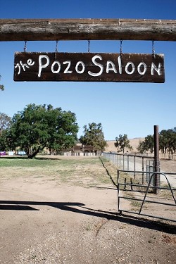 WELCOME TO POZO SALOON :  Concertgoers enter the outdoor venue through this portal, filing into the field to the left, which will be filled with upwards of 3,000 people when the Black Crowes play. - PHOTO BY STEVE E. MILLER