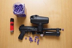 RED-EYE FIGHT :  Paintballs filled with pore-stinging Oleoresin Capsicum provide officers with an option besides batons or guns. - PHOTO BY STEVE E. MILLER
