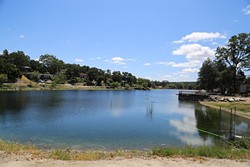 WHODUNIT?:  A substance believed to be &ldquo;pond dye&rdquo; was discharged into Atascadero Lake on April 18, turning the lake bright blue. The color has diminished since, but the California Department of Fish and Wildlife is still investigating who did it and if the solution was toxic. - PHOTO BY DYLAN HONEA-BAUMANN