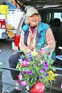 IN BLOOM:  Ruth &ldquo;The Flower Lady&rdquo; Scovell of Orchard to You Farm in Atascadero has been selling at the Downtown SLO Farmers&rsquo; Market for the past 36 years. - PHOTO BY DYLAN HONEA-BAUMANN