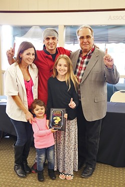 FAMILY FIRST:  The family behind Shave &rsquo;N Flav&mdash;Steven Sullivan (chef), Brittany Torres (wife), Serenity Sullivan (youngest daughter), Sydney Sullivan (oldest daughter)&mdash;accepts their first place award for Judge&rsquo;s Choice award from Atascadero Mayor Tom O&rsquo; Malley. - PHOTO BY DYLAN HONEA-BAUMANN