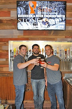 CHEERSING EACH OTHER ON:  From left: Street Side Ale House co-owners Trevor LaSalle, Chris Durkin, and Taylor Reese. Not pictured: fellow co-owner Eric Peterson, who was hard at work creating a back patio for the Atascadero craft beer and comfort food hangout. - PHOTO BY DYLAN HONEA-BAUMANN
