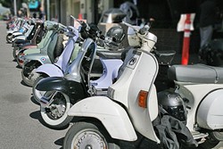 ALL THE PRETTY SCOOTERS:  About 80 scooters participated in this year&rsquo;s annual Rides of March rally, shown here parked on Monterey Street outside Palazzo Guiseppe. - PHOTO BY GLEN STARKEY