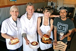 FACTORY WORKERS :  From left, Flavor Factory Chef/Owners Dawnelle and Adam Pollard, their daughter and cook Camille Pollard, and fellow employee David Ramirez. They&rsquo;re holding from-scratch mango cheesecake, tortilla soup, and a juicy burger, all of which have become staples of the new Morro Bay hangout. - PHOTO BY HAYLEY THOMAS