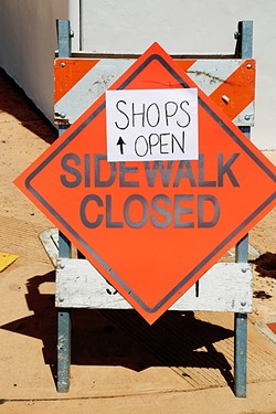CLOPING:  The shuttered parking lot, closed sidewalks, and construction activity has made things difficult for some of the locally-owned businesses surrounding the Chinatown project on Monterey Street in downtown SLO. - PHOTO BY DYLAN HONEA-BAUMANN