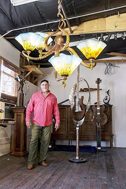 UNDER THE SEA :  Dale Evers&rsquo; artistic career began with a focus on whales, and sea creatures are still a source of inspiration for him. Evers is pictured here with a recent creation, an octopus lamp. - PHOTO COURTESY OF DALE EVERS STUDIO