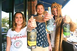 COCKTAIL CREW :  From left, Calivore Spirit Co. owners Raleigh Nejame, Aaron Bergh, and  Luke Beaton show off their bottles of blonde rum, spiced rum, and Big Sur-inspired gin. - PHOTO BY HAYLEY THOMAS