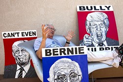 POSTER ARTIST:  Los Osos-based street artist Robbie Conal hangs out with his Donald Trump and Bernie Sanders paintings. The Trump ones are also available in poster form. - PHOTO BY JAYSON MELLOM