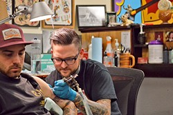 INK ARTIST:  Gary Ellsworth tattoos a client. - PHOTO COURTESY OF GARY ELLSWORTH