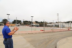 FOR THE LOVE OF ATHLETICS :  Morro Bay High School Principal Kyle Pruitt stands by his campus&rsquo;s tennis courts, which are in the process of being refurbished. Work for the high school&rsquo;s new pool is also underway. - PHOTO BY DYLAN HONEA-BAUMANN