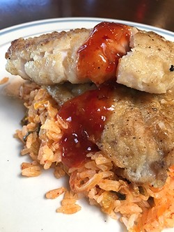FINE FILLET:  Nosh Delights served up a roasted sea snapper with kimchi fried rice and sweet chili sauce at a recent beer pairing event. - PHOTO BY REID CAIN