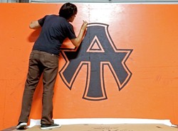 A-TOWN DOWN!:  Silas Corley hand paints the A-Town logo for the skate park in Atascadero. His work was recently featured on the cover of the city&rsquo;s summer 2016 recreation guide. - PHOTO COURTESY OF SILAS CORLEY