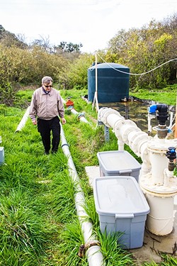 FLOWING:  Cambria Community Services District engineer Bob Gresens explains what it takes to purify water enough to supply it as a community resource. - PHOTO BY JAYSON MELLOM