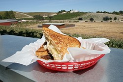 LOUNGE WITH A VIEW:  The view from Barton Family Wines&rsquo; new outdoor lounge area is pretty epic. So is this brisket Reuben sandwich, crafted by Chef Jeffry Wiesinger of Jeffry&rsquo;s Catering, located onsite. - PHOTO BY HAYLEY THOMAS CAIN