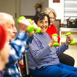 MOVING TOGETHER:  Attendees of the SLO Senior Citizens Center&rsquo;s chair exercise program get to sit, stretch, and exercise in a group. Socializing, singing, and laughter are all part of the program as well. - PHOTO BY JAYSON MELLOM