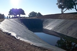 POND PROBLEMS:  This 4-acre-foot ag pond serves a vineyard on Willow Creek Road west of Templeton. The permitting process for ag ponds is under fire after a series of controversial ag ponds inflamed tensions in the community over water availability. - PHOTO COURTESY OF THE UPPER SALINAS-LAS TABLAS RESOURCE CONSERVATION DISTRICT
