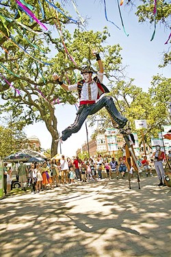 DAY OF WONDER:  A stilt walker leaps in the air at the downtown park in Paso Robles as part of Paso ArtsFest last year. - PHOTO COURTESY OF ALLYSON MAGDA