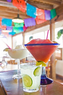 MARGARITA HEAVEN:  Old Juan&rsquo;s Cantina in Oceano has margaritas on margaritas&mdash;in practically any flavor you&rsquo;d want. Pictured on the bar from front to back are the Cucumber Margarita, Super Strawberry Margarita, and Margarita Classico. - PHOTO BY JAYSON MELLOM