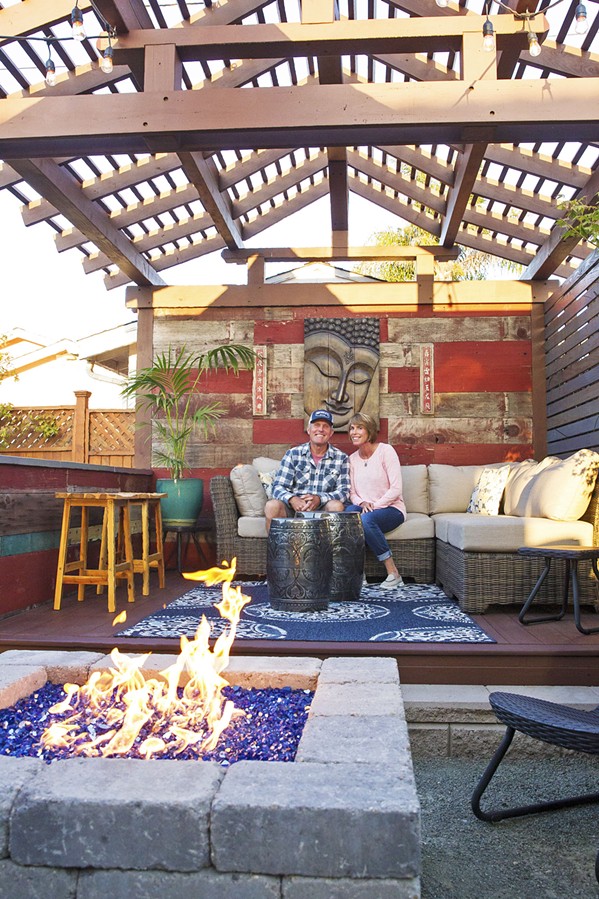 PERFECT GETAWAY Because their Shell Beach home is small, Kevin and Susan Bratcher spread out in all directions, creating an Asian pergola in the backyard that doubles as a stage for house concerts. - PHOTO BY JAYSON MELLOM