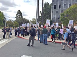 ON THE MARCH When negotiations fail, local unions can threaten to call for a strike, like these members of the California Faculty Association at Cal Poly. - FILE PHOTO