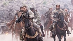 HORSE SOLDIERS In the aftermath of 9/11, Capt. Mitch Nelson (Chris Hemsworth) leads a U.S. Special Forces team into Afghanistan on a dangerous mission in 12 Strong. - PHOTO COURTESY OF WARNER BROS. PICTURES