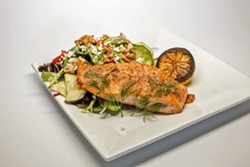 UP STREAM Simple, classic grilled salmon is served alongside a bed of greens topped with walnuts and honey mustard vinaigrette. - PHOTO COURTESY OF BY MELISSA MATTSON