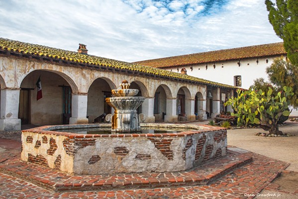 CALIFORNIA HISTORY North County photographer Dean Crawford often uses various filters when capturing images like this one of Mission San Miguel in order to give the piece a surreal look. - PHOTO BY DEAN CRAWFORD