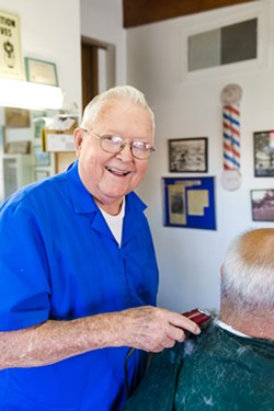 PAGE OUT OF HISTORY Dan Phillips has been cutting hair in his barber shop since 1961 and has watched Atascadero change through his front windows. - PHOTO BY JAYSON MELLOM