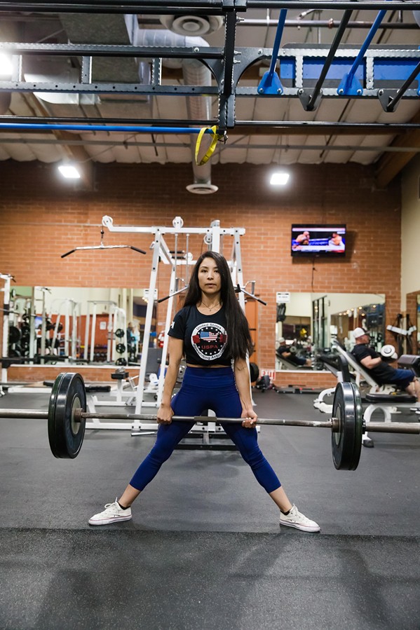 RAISING THE BAR Inside FitnessWorks of Morro Bay, Denise Juarez attempts a deadlift, one of the three lifts in powerlifting. - PHOTO BY JAYSON MELLOM