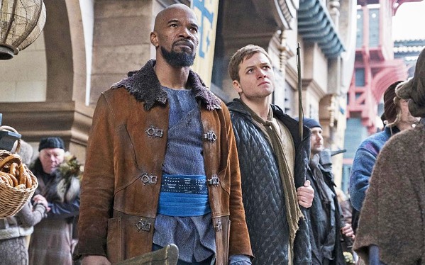 BOYS IN THE HOOD Former Crusader-turned-rebel Robin of Loxley (Taron Edgerton, right) and his Moorish partner, Little John (Jamie Foxx), take on the corrupt British crown, in Robin Hood. - PHOTO COURTESY OF LIONSGATE