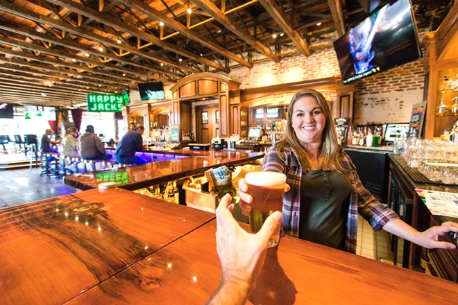 HIP AND HAPPENING Bartender Jessica Doyle serves up a cold one at the best North Coast bar in the county, The Siren in Morro Bay. - PHOTO BY JAYSON MELLOM