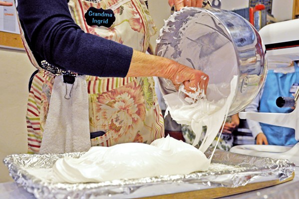 MIDDLE PRODUCT In a cooking demo during the Feb. 9 candy-making glass, Grandma Ingrid smooths marshmallow fluff into a baking sheet, where it will set. Depending on the size you want your finished mallow to be, she says, you can go with a taller dish. - PHOTOS BY CAMILLIA LANHAM