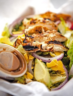 CALI GREENS Citrus marinated grilled chicken, roasted poblano pepper, and applewood bacon marry avocado, tomato, red onion, and aged cheddar&mdash;dressed up with cilantro vinaigrette, this is a salad you can sink your teeth into. - PHOTO BY PATRICK IBARRA