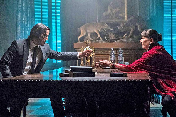 BLOOD PACT Wick (Keanu Reeves, left) demands safe passage for turning in his marker to The Director (Angelica Huston), who in doing so risks retaliation from the High Table, leaders of an assassins' guild. - PHOTOS COURTESY OF SUMMIT ENTERTAINMENT