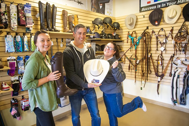 GETTIN' HORSEY WITH IT Need some tack? The Riding Warehouse in SLO has got your back—and so do Alisha Goto, Tony Camacho, and Christine Dietrich (left to right). - PHOTO BY JAYSON MELLOM
