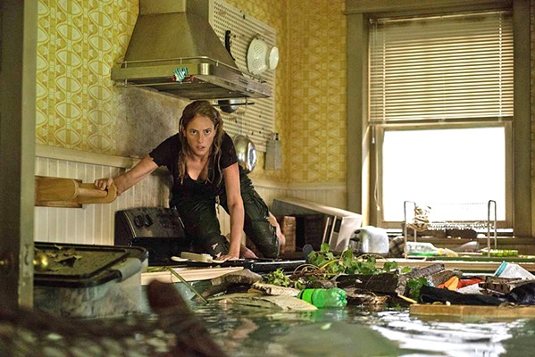 TEETH Haley Keller (Kaya Scodelario) returns home to save her father during a hurricane but discovers the flooding house is infested with alligators, in Crawl. - PHOTO COURTESY OF PARAMOUNT PICTURES