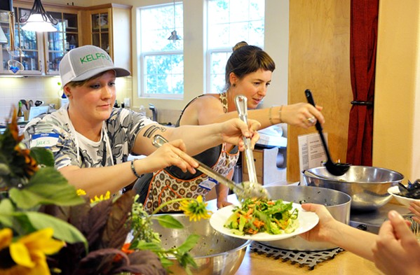 DINNER IS SERVED Jules Marsh (left) and Melissa Hanson from Kelpful dish up a seaweed feast to hungry diners during an educational dinner in July. - PHOTO BY JAYSON MELLOM