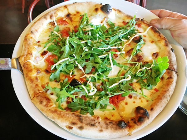 DEAR OLD NAPOLI This is the pizza that gets the Italians excited. Soft, thin, bubbly crust and simple, fresh ingredients. Straight out of the wood-burning oven, this is the BLTE: bacon, roasted tomato, mozzarella,Tuscan pecorino, arugula, egg, and aioli. - PHOTOS BY BETH GIUFFRE