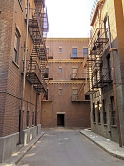 DOES WHATEVER A SPIDER CAN! This alleyway on the Warner Bros. lot is where Mary Jane Watson kissed an upside down Spider-Man, in Spider-Man (2002). - PHOTOS BY GLEN STARKEY