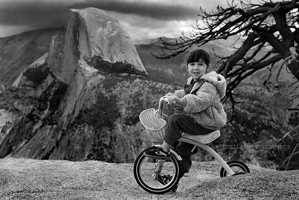 JOURNEY THROUGH TIME This photo of photographer Steve Udell's daughter, shot in 1984 at Glacier Point, is part of the People and Places exhibit. The original film photo did not develop properly, but Udell was able to save it with modern technology. - PHOTO COURTESY OF STEVE UDELL
