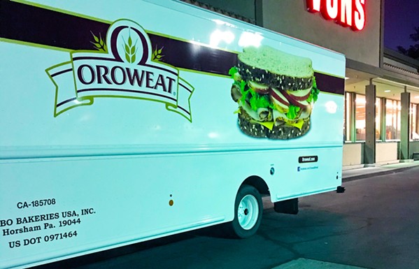 CROSS-COUNTRY FOOD An Oroweat bread truck parked outside Vons in Atascadero in the early morning hours reminds us that high gas prices often mean the price of our food staples will rise too, especially when trucks come over from places like Pennsylvania. - PHOTO BY BETH GIUFFRE