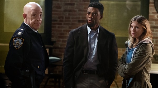 LAW AND ORDER? Chadwick Boseman (center) stars as NYPD Detective Andre Davis, surrounded by Capt. McKenna (J.K. Simmons, left) and Frankie Burns (Sienna Miller), in the so-so action crime drama 21 Bridges. - PHOTO COURTESY OF HUAYI BROTHERS