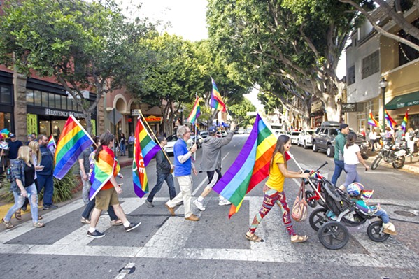 WANTING INCLUSIVITY A group of demonstrators show their pride on Higuera Street in downtown SLO during a rally in 2017. - FILE PHOTO BY JAYSON MELLOM