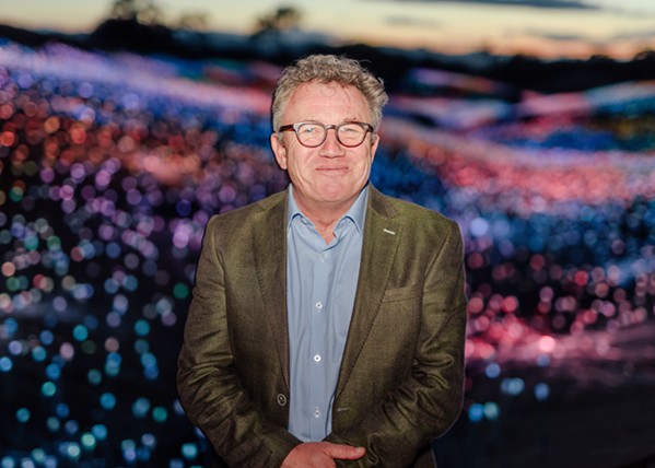 VISIONARY English/Australian artist Bruce Munro stands among his installation, Field of Light at Sensorio, in Paso Robles. - PHOTO COURTESY OF DAVID GREER