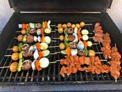 GRILLING AND CHILLING Since we couldn't walk over to the vendors row for chow, we were forced to cook our own, like these veggie and chicken kabobs. - PHOTO BY GLEN STARKEY