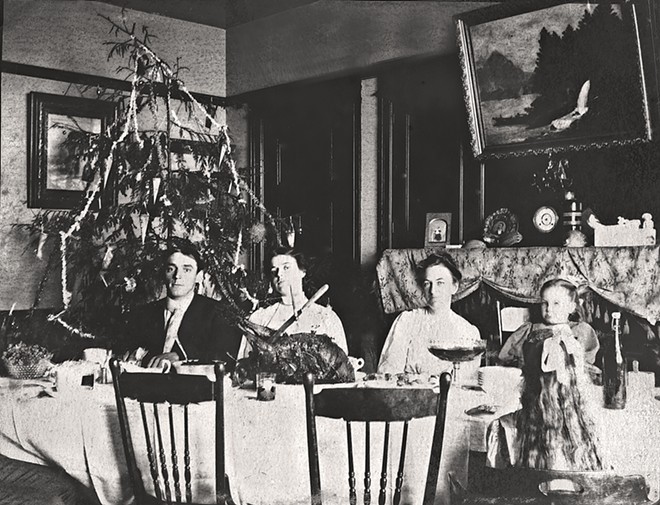 BYGONE ERA The book is filled with historic photos such as this circa 1905 image of Christmas dinner inside the keeper's dwelling at Point Sur. Although not taken at Point San Luis, the photo offers a rare glimpse of a keeper's family celebrating Christmas at a West Coast light station.