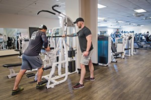 GET FIT Brian Peffly (left) works with trainer John Hornbuckle at Kennedy Club Fitness in SLO. Kennedy won Best Health Club/Gym in this year's annual readers poll. - PHOTO BY JAYSON MELLOM