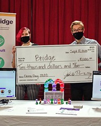 STARTUP SUCCESS Entrepreneurs behind the startup Bridge hold up their $10,000 check that the Cal Poly Center for Innovation and Entrepreneurship provides to eight teams each year through its HotHouse Summer Accelerator program.